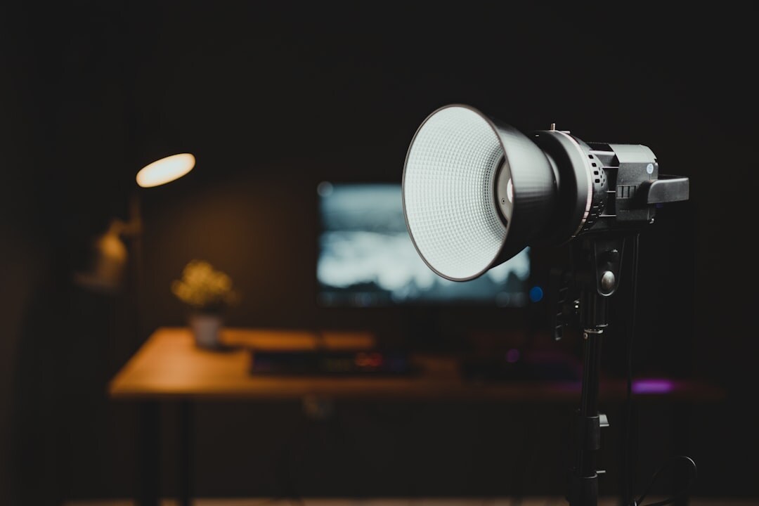 Television studio set with multiple cameras positioned around a desk